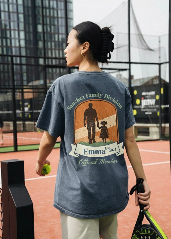 Person wearing a t-shirt with a graphic design on a tennis court