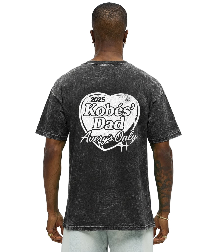 Man wearing a black t-shirt with text on the back against a white background